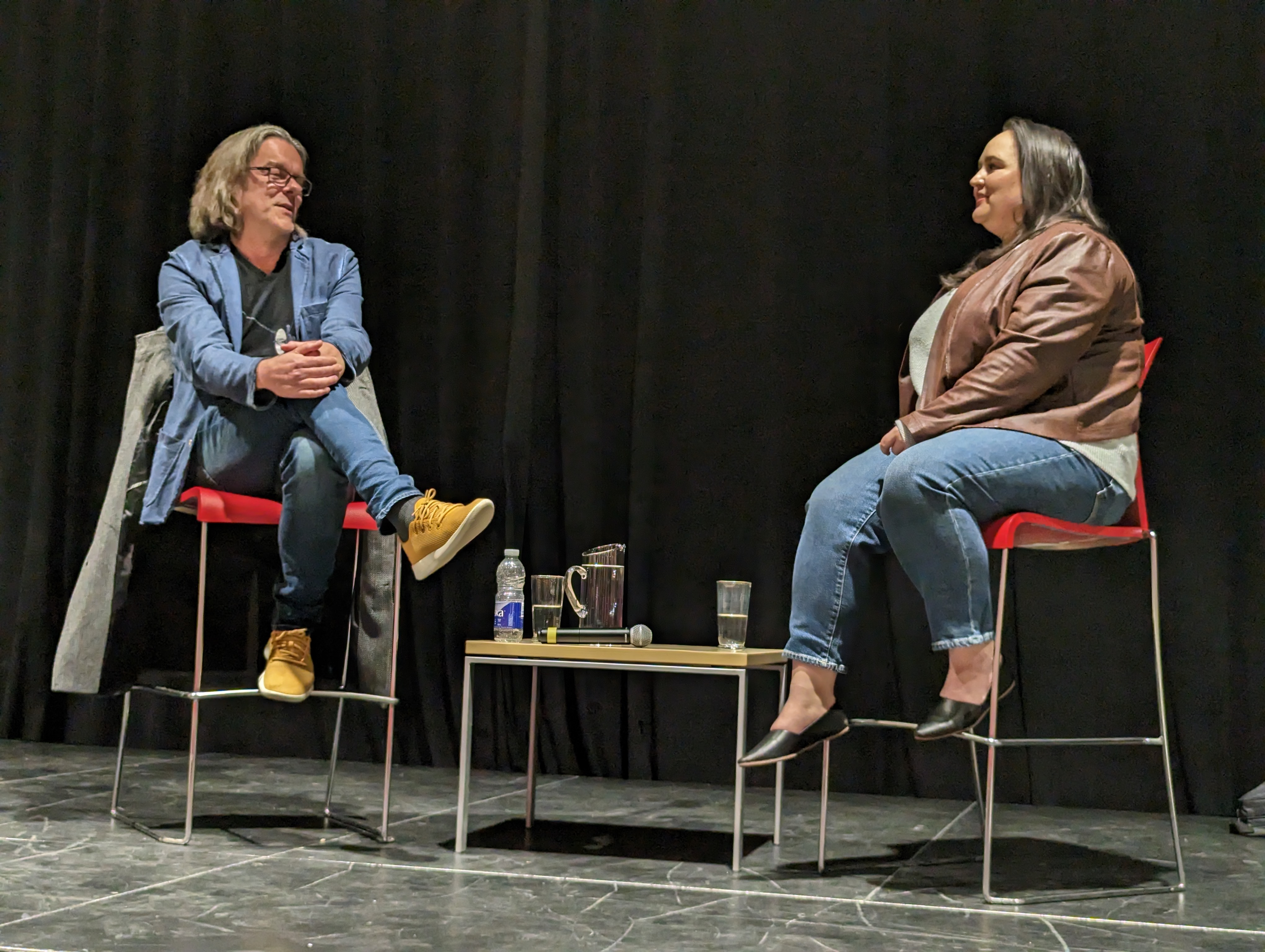 Sylvain Neuvel and Melissa Blair appear seated onstage at the St. Lawrence auditorium.